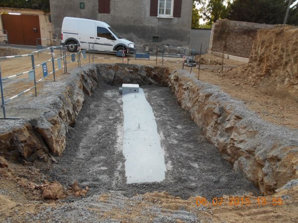 Cuve posée et remblayée en béton